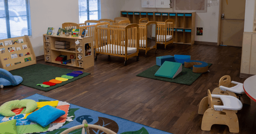Infant classroom at Grateful Hearts Inc. in Las Vegas with cribs, soft play materials, learning centers, and safe licensed affordable childcare.